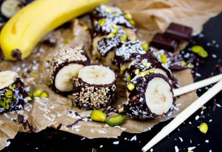 Banana pieces covered in chocolate, nuts and seeds.