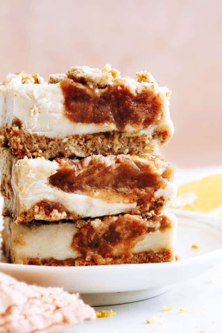 A stack of three apple cheesecake bars.