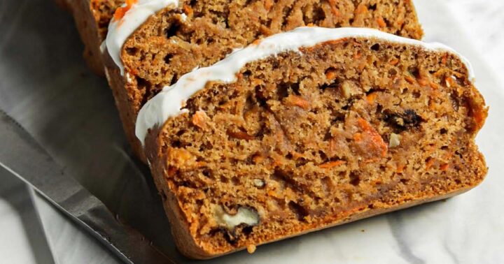 Slices of banana carrot bread with frosting on top.