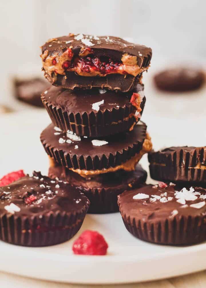 A stack of nut butter cups with a raspberry filling.
