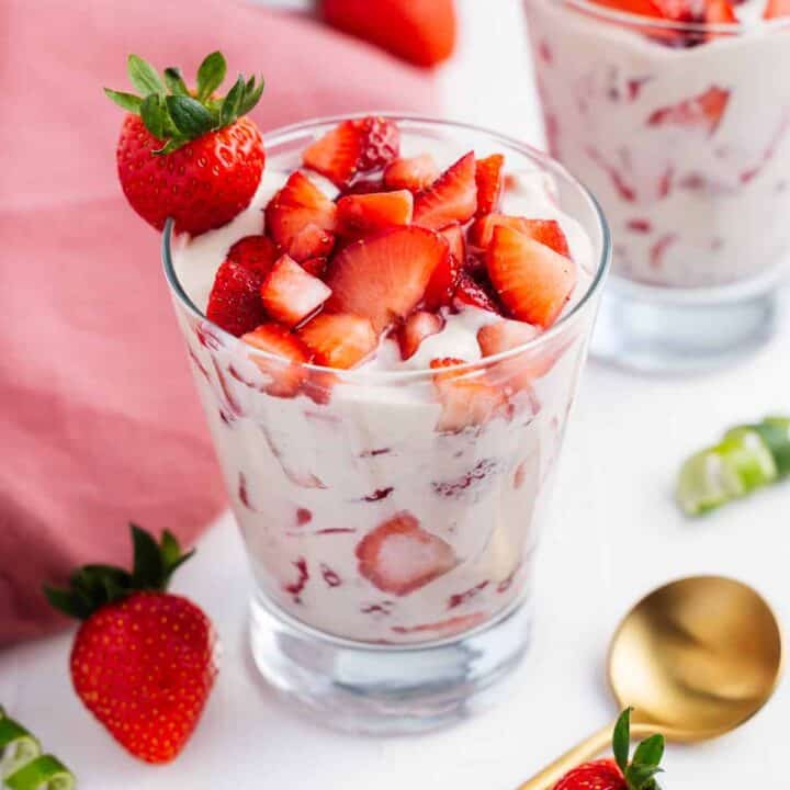 A glass full of vegan strawberries and cream.