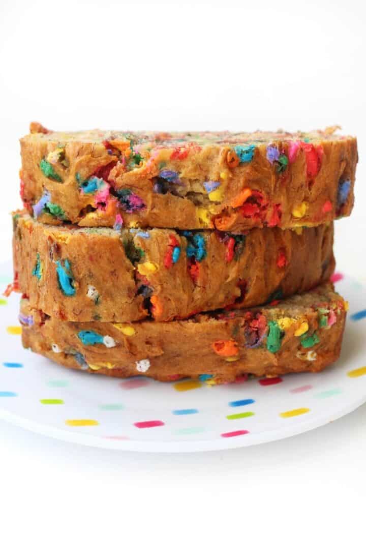 Three slices of banana bread with multicolored sprinkles in.