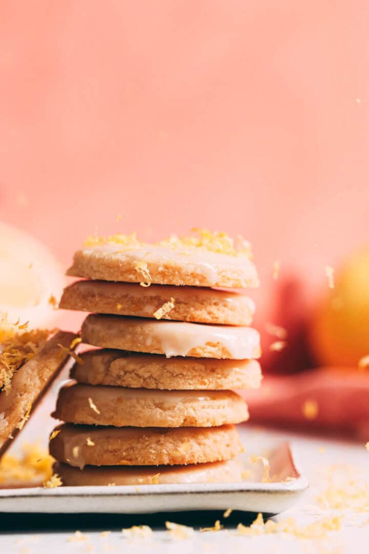 A stack of shortbreads with lemon zest on top.