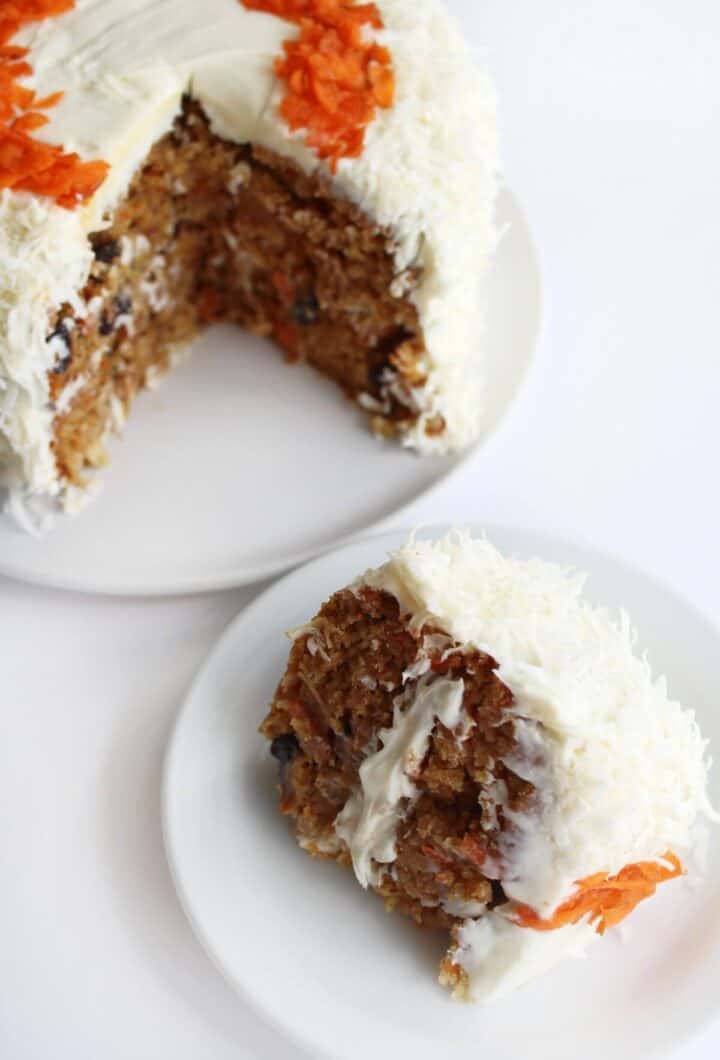 A small carrot cake covered in shredded coconut.