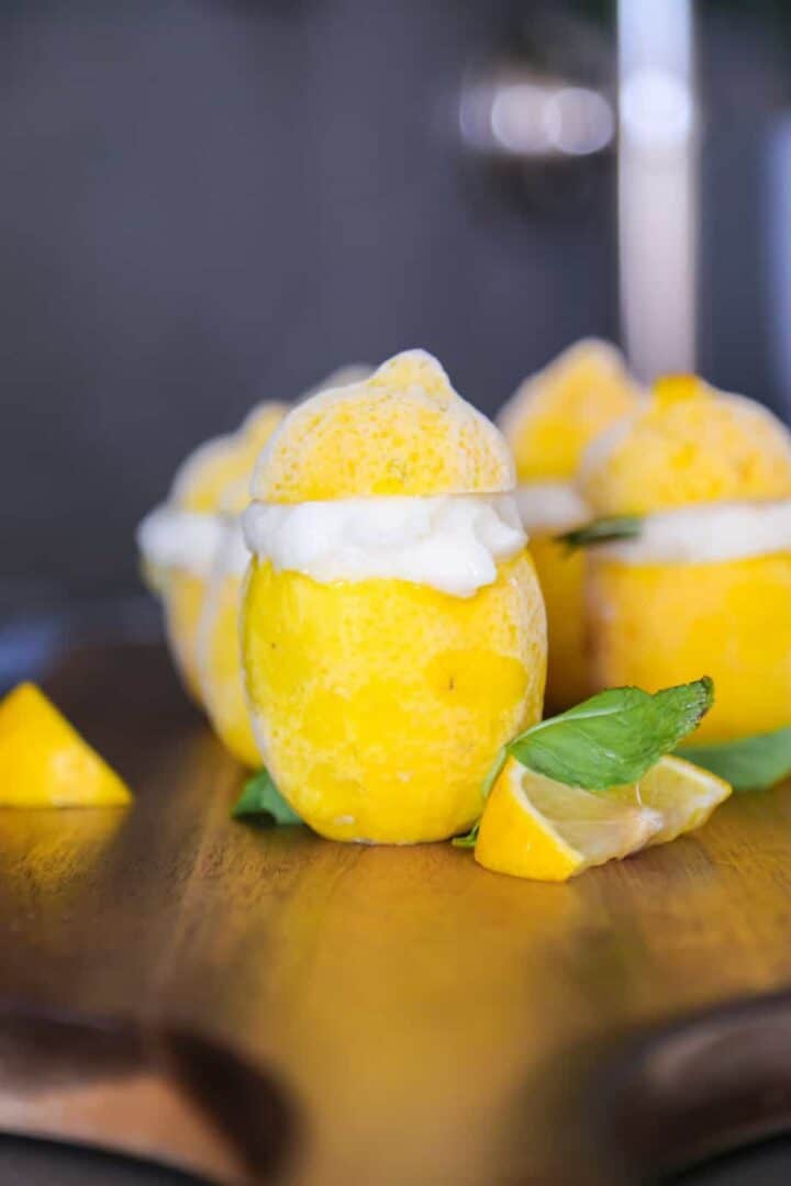 Lemon sorbet served inside frozen lemons.