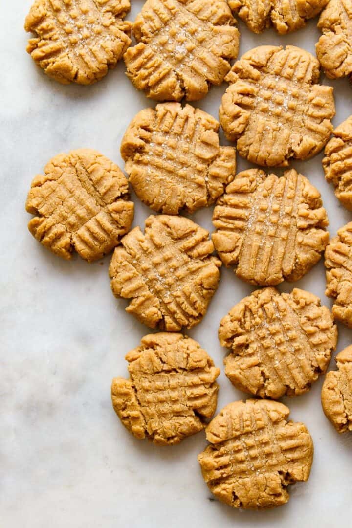 Peanut butter cookies with fork marks on top.