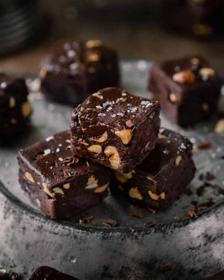 Three pieces of fudge with chopped nuts and salt.