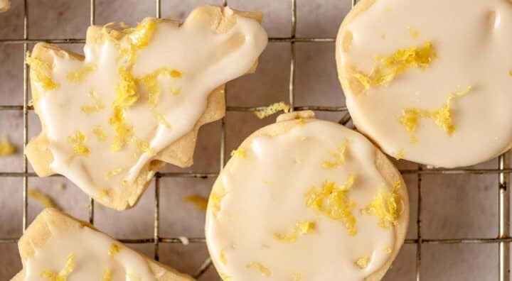 Cut out glazed lemon cookies on a wire rack.