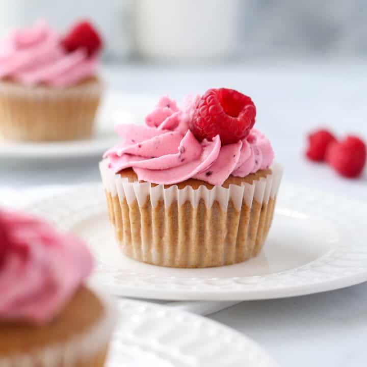 A cupcake topped with raspberry buttercream.