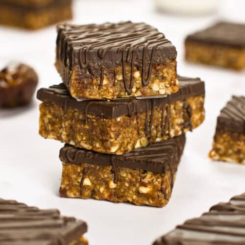 A stack of three chocoate, nut and date bars.