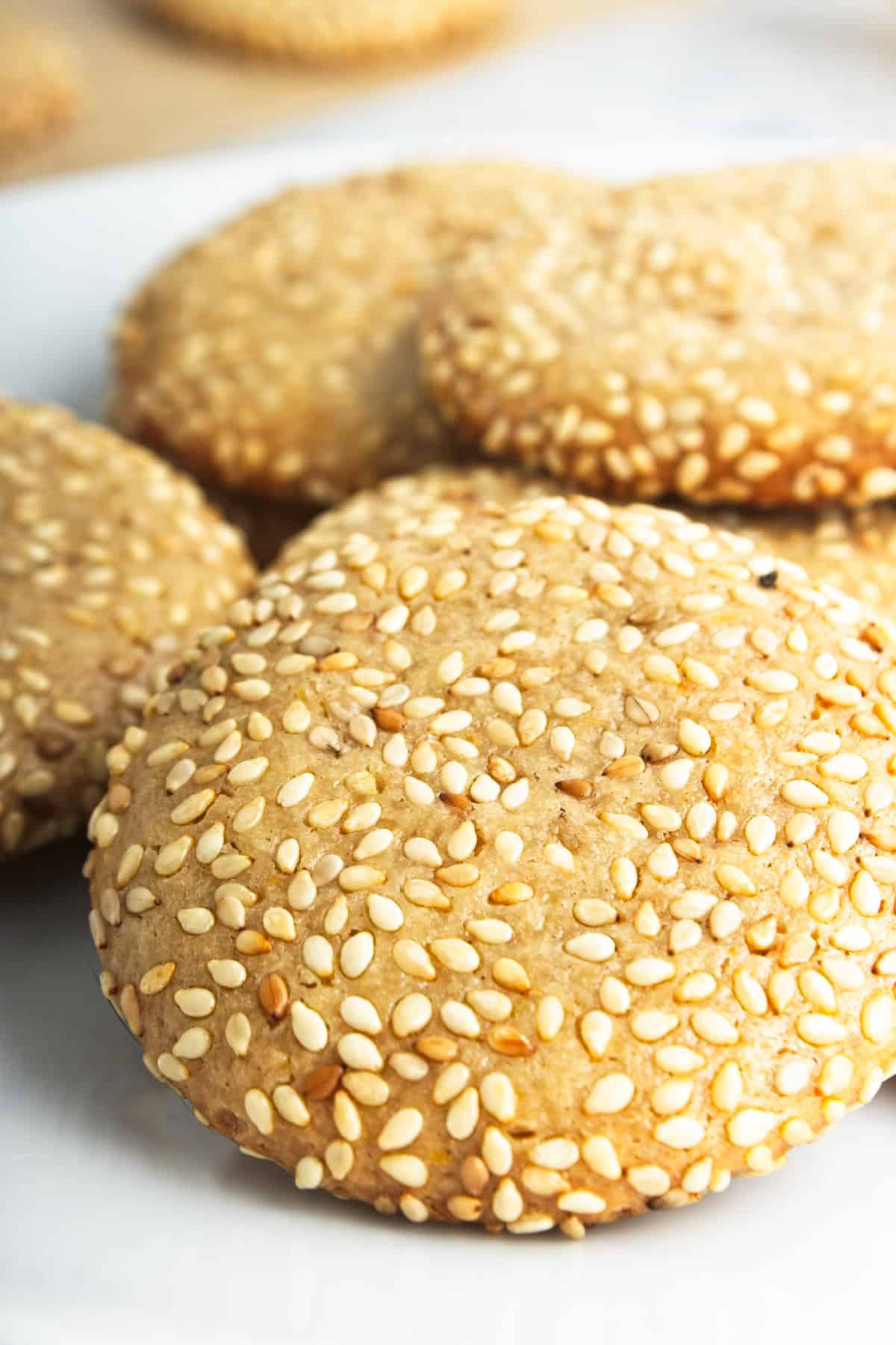 A golden brown cookies covered in seseame seeds.