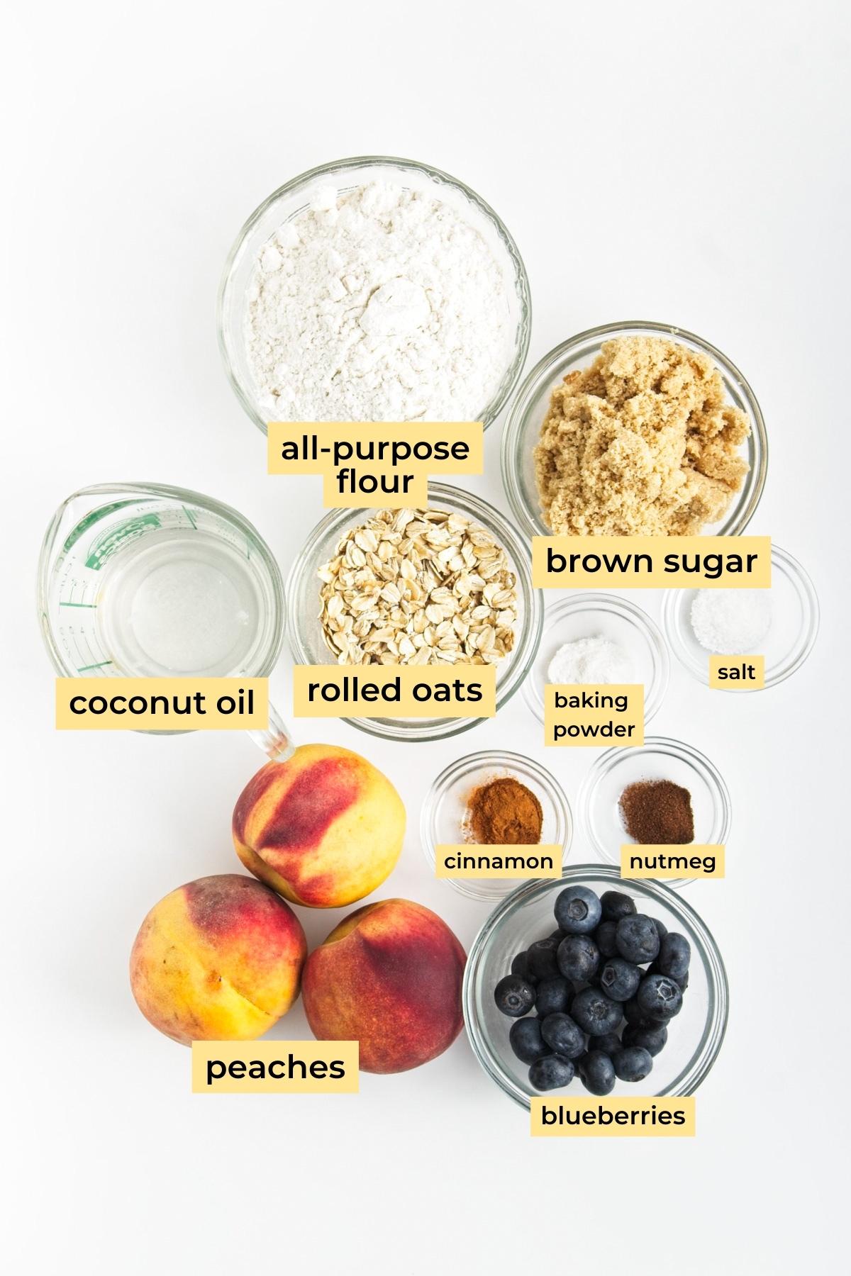 Ingredients: all-purpose flour, coconut oil, brown sugar, rolled oats, baking powder, salt, cinnamon, nutmeg, blueberries and peaches.