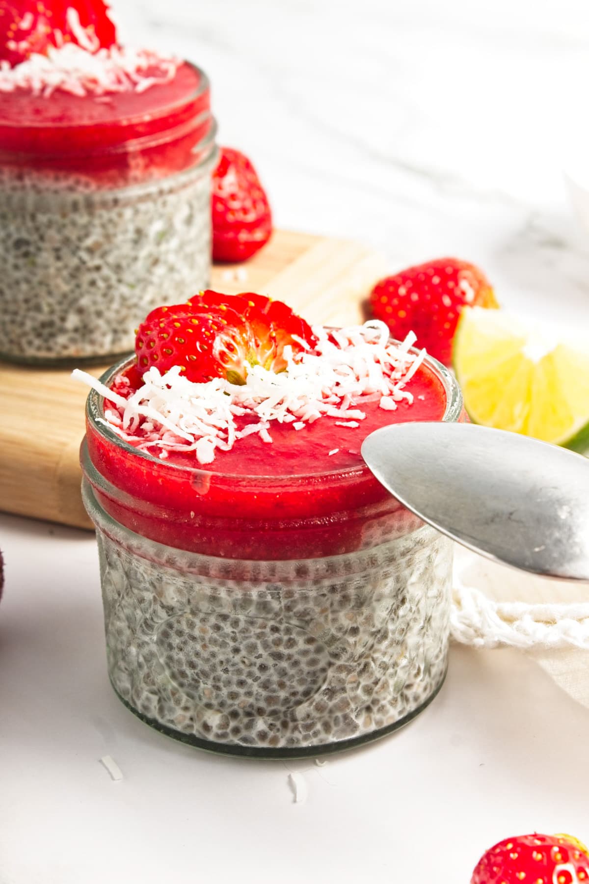 A spoon ready to dip into a chia pudding.